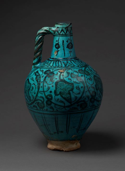 A turquoise glazed jug
