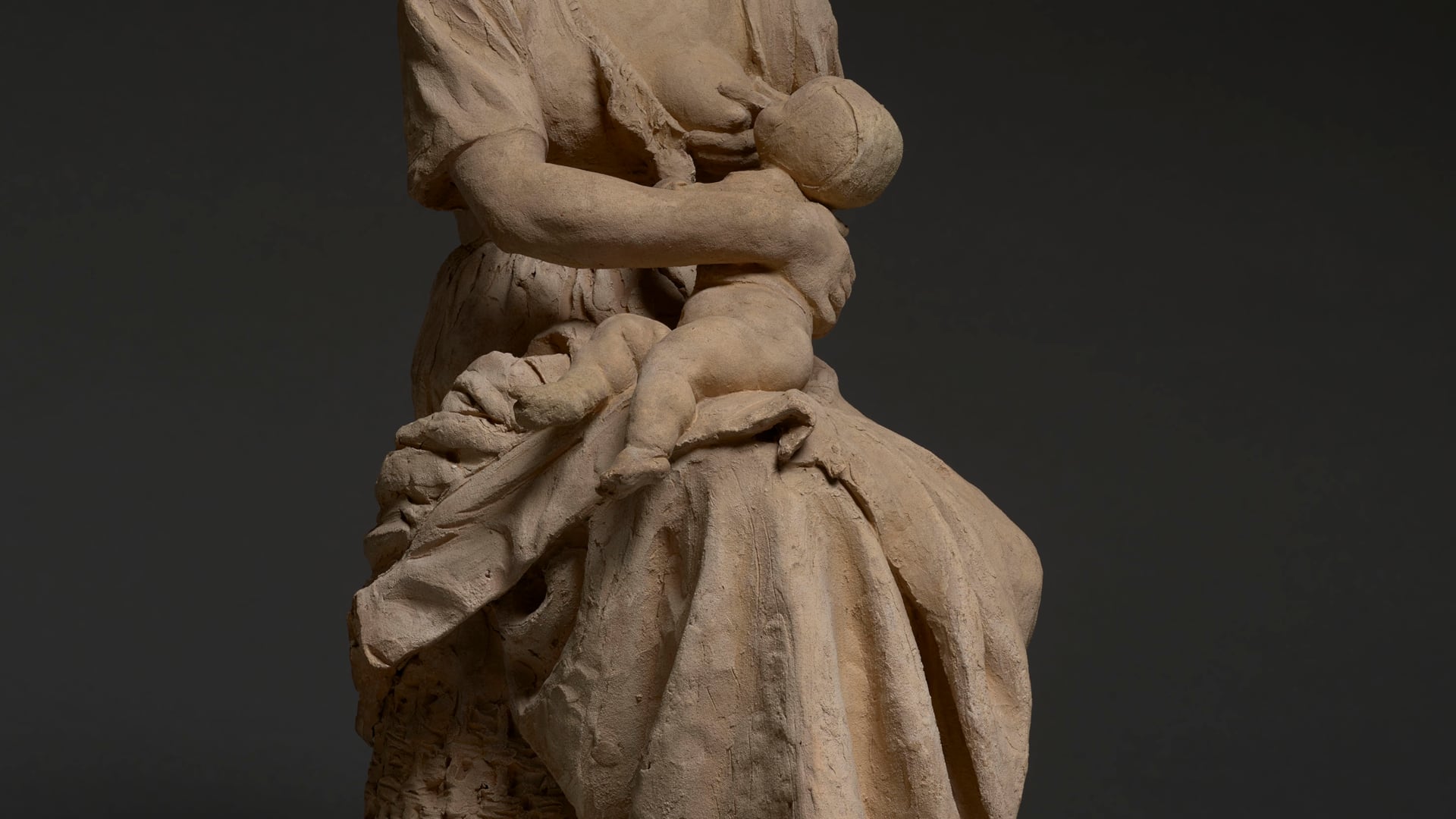 French peasant woman nursing a baby