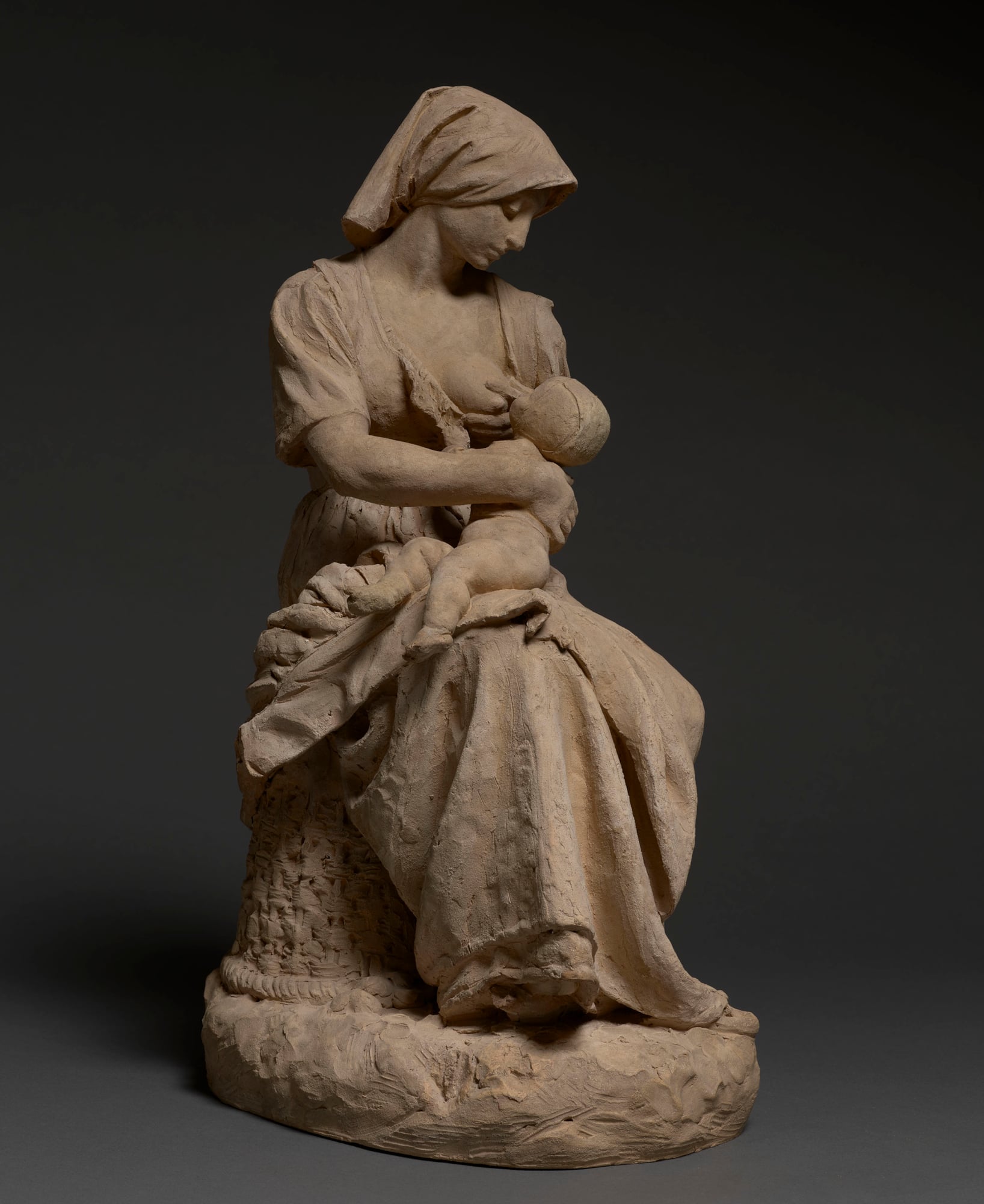French peasant woman nursing a baby